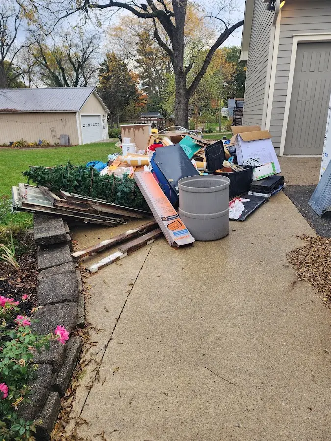 Dumpster being loaded with debris for Roofing Dumpster Rental in Mount Vernon